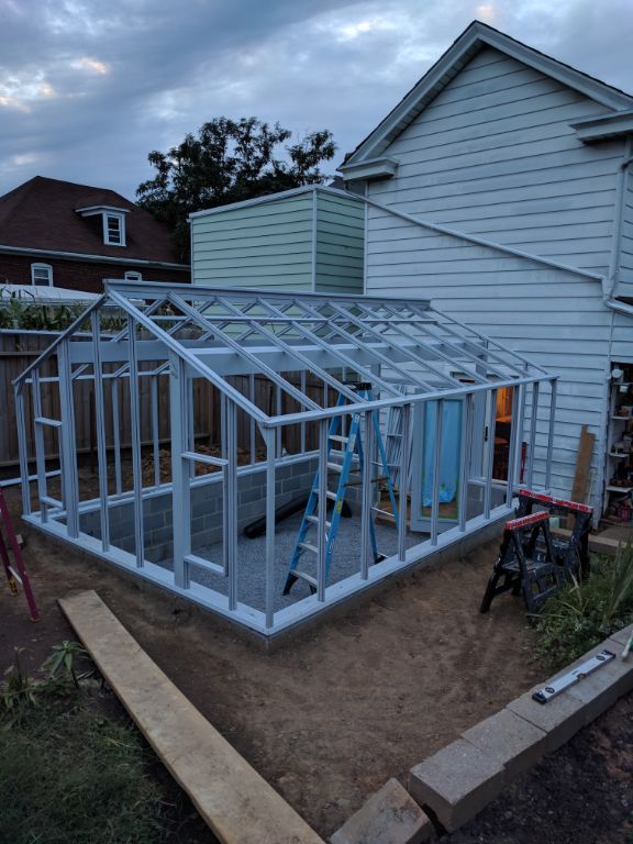 Stained heart redwood greenhouse frame in place